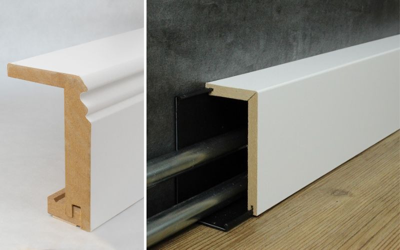  Rohrabdeckleisten in Weiß: links MDF-Leiste im Querschnitt, rechts montierte Rohrabdeckleiste verdeckt zwei Heizungsrohre an der Wand und sorgt für einen sauberen Abschluss zum Boden